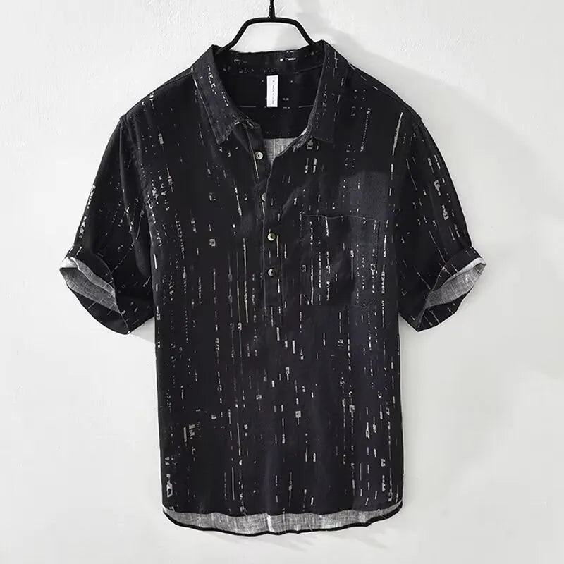 Man wearing a loose-fit black lapel polo shirt, a short-sleeved cardigan-style t-shirt for summer.