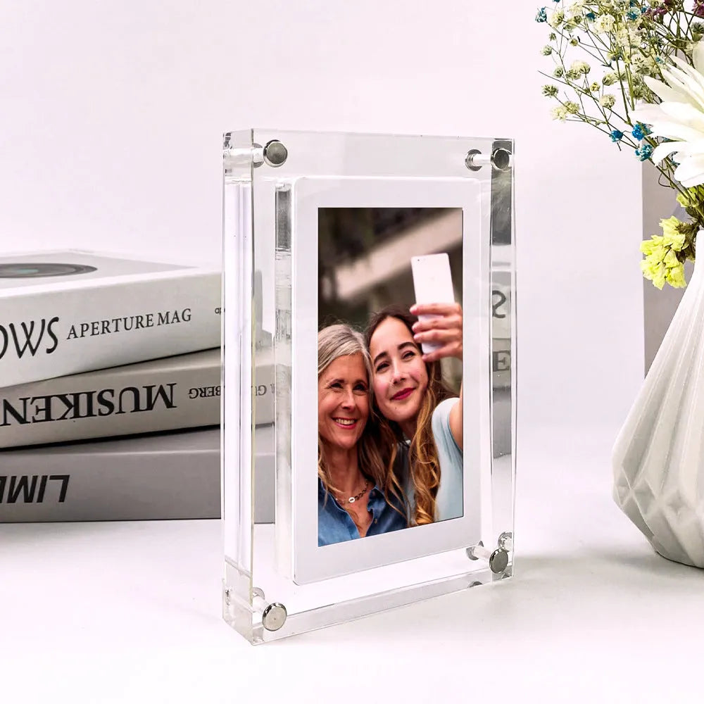 White acrylic digital photo frame with 5-inch vertical screen showing family photos