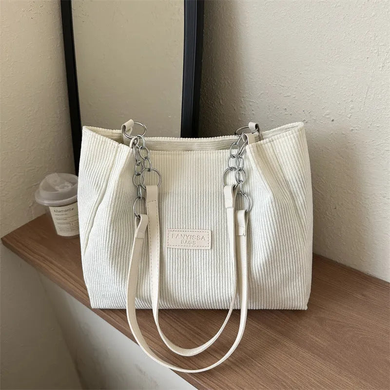Corduroy women's tote handbag with one-shoulder strap and three-dimensional pocket in horizontal square shape