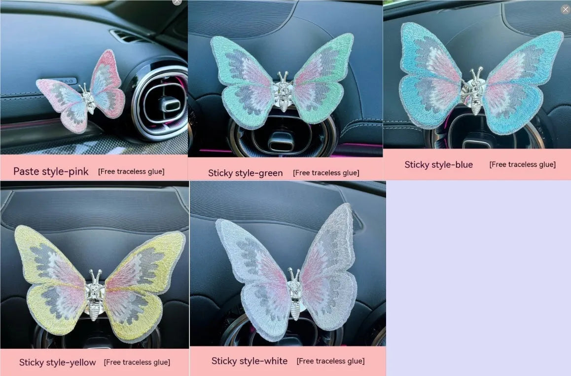 Soft fabric embroidered butterfly car air vent decoration in multiple colour options on a centre console.