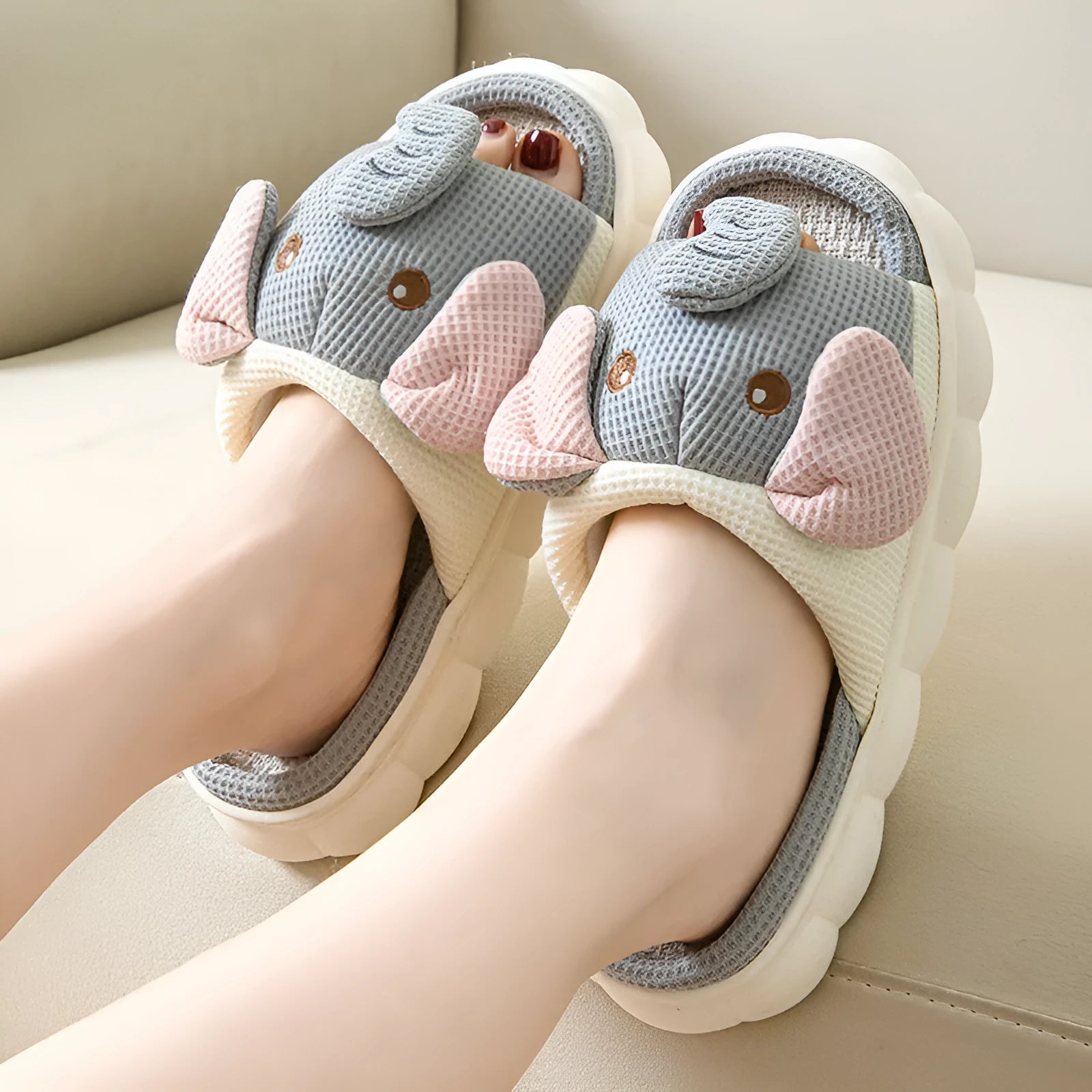 Elephant grey open-toe linen slippers for couples on a plain background, showing animal pattern detail and sewn sole.