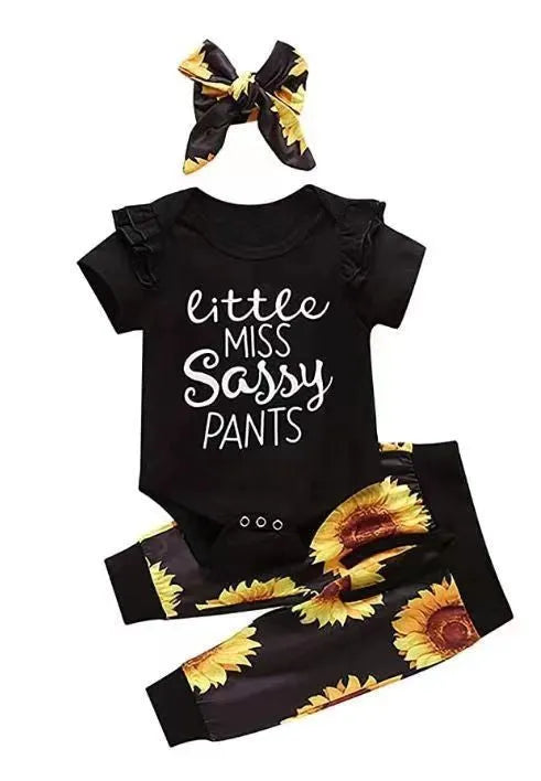 Baby jumpsuit set with cotton top, pants, and matching headband in black letter print