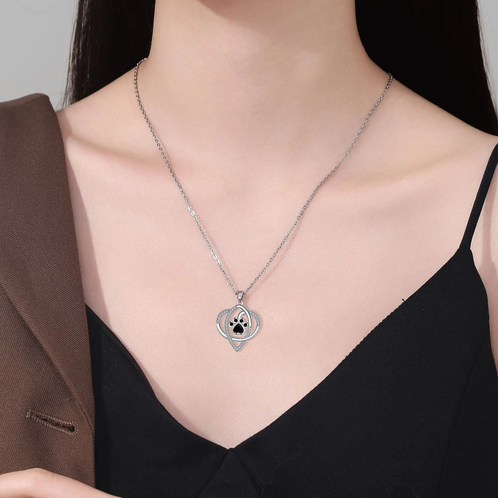 Women's copper necklace with dog paw pendant on cross chain