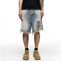 Light blue washed denim shorts for men with a baggy fit and mid waist, shown on a hanger.