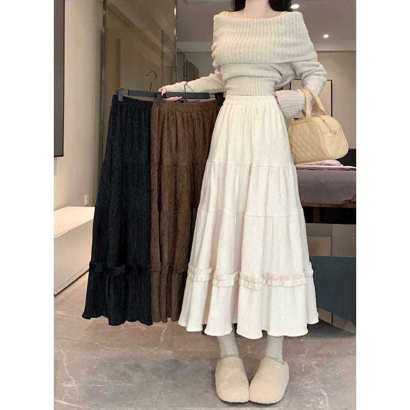 Women's solid colour corduroy A-line midi skirt with elastic waistband in milky white.