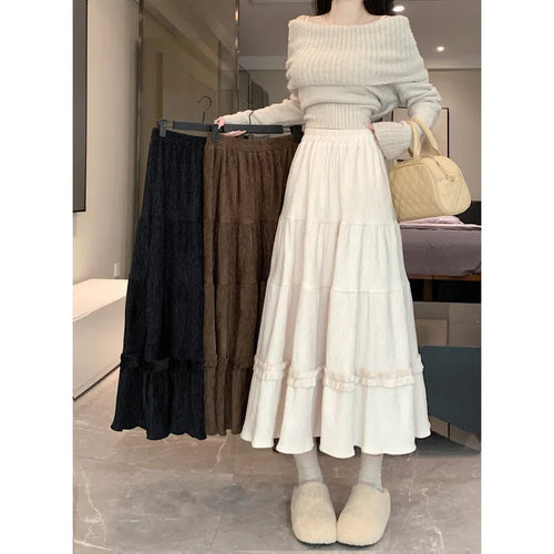 Women's solid colour corduroy A-line midi skirt with elastic waistband in milky white.
