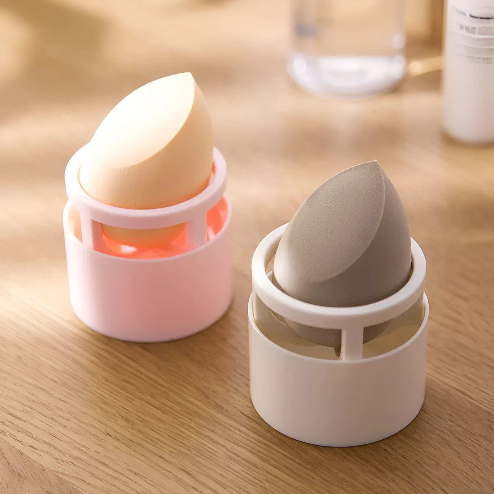 Pink plastic beauty egg stand storage rack for cosmetics on a bedroom shelf