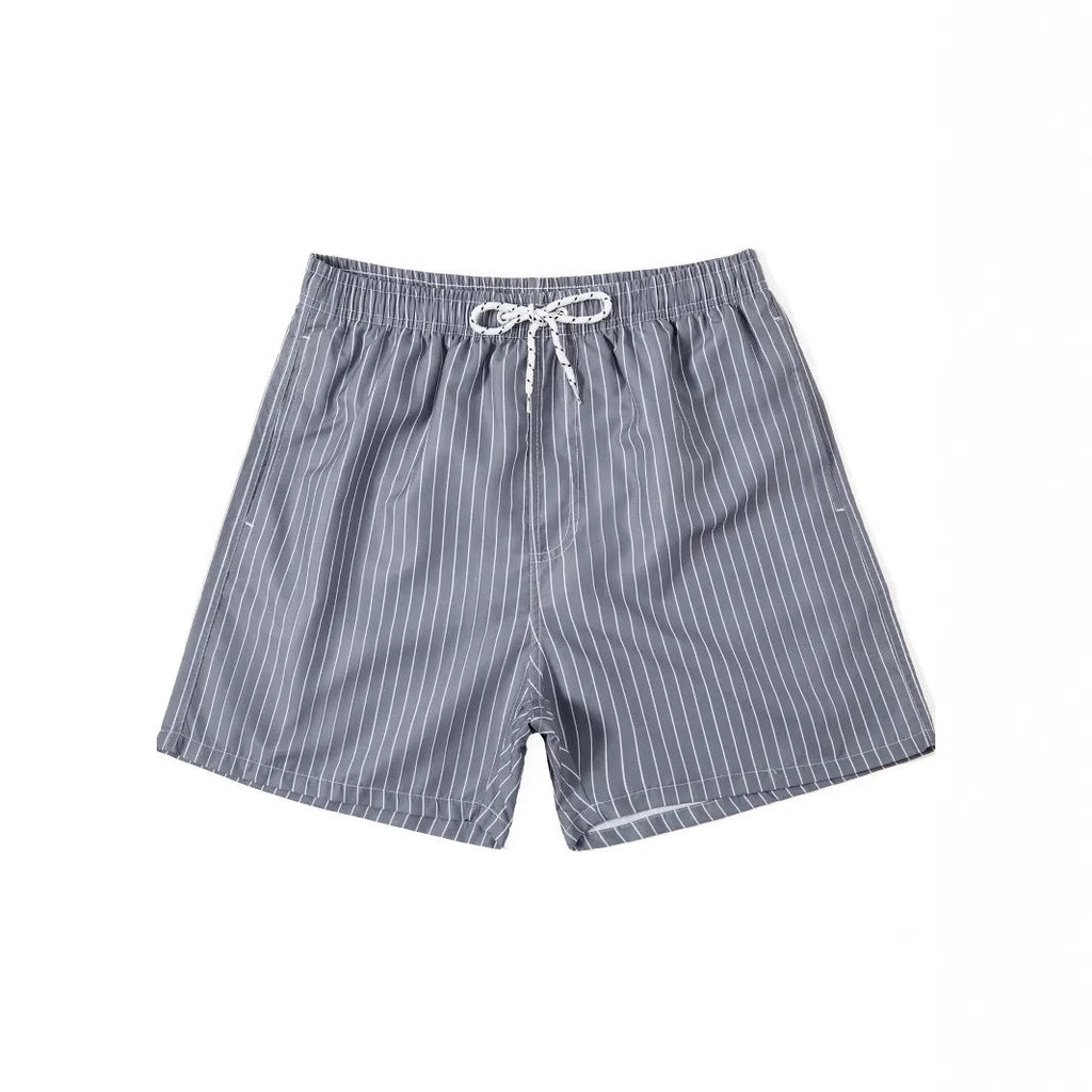 Men's navy blue polyester beach shorts with striped triangle lining and straight leg opening.