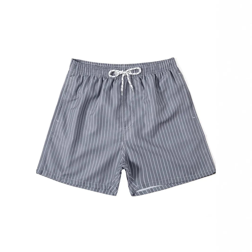 Men's navy blue polyester beach shorts with striped triangle lining and straight leg opening.