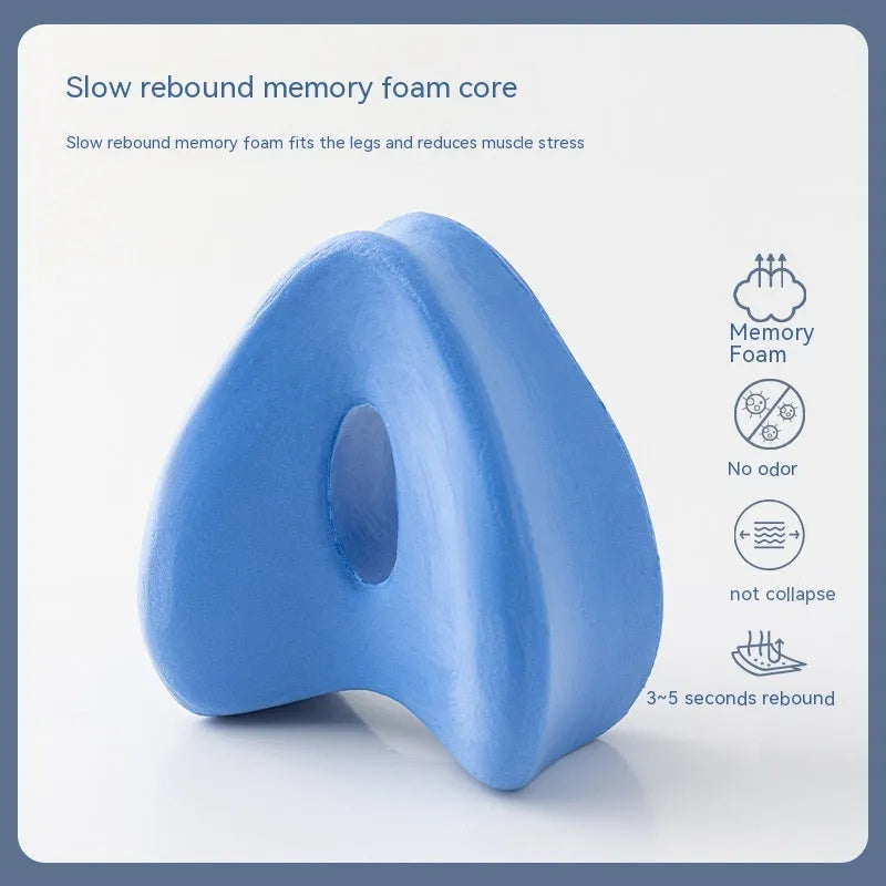 A dark blue jacquard love heart-shaped memory foam leg pillow for adults.