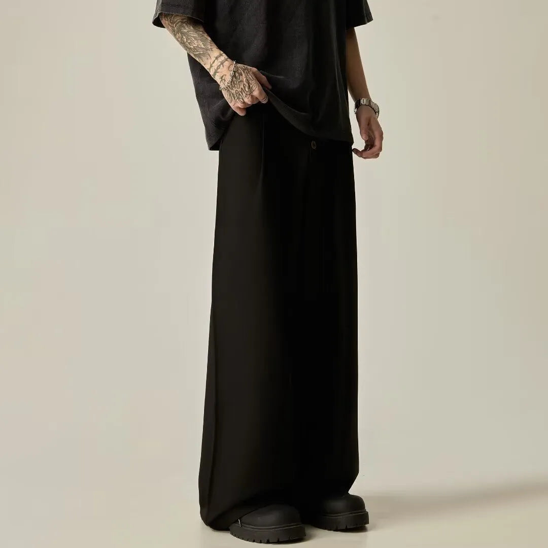 Men's black wide-leg casual trousers with vertical stripes and an elastic waistband.