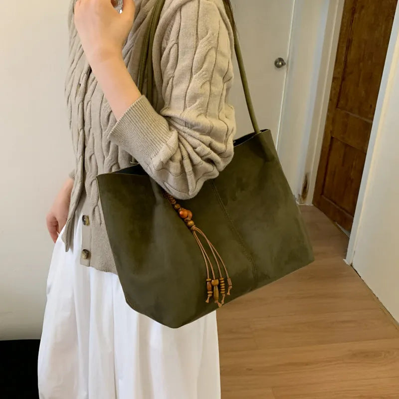 Large suede tote bag in brown with matching pendant, horizontal square shape, single shoulder strap, and retro styling