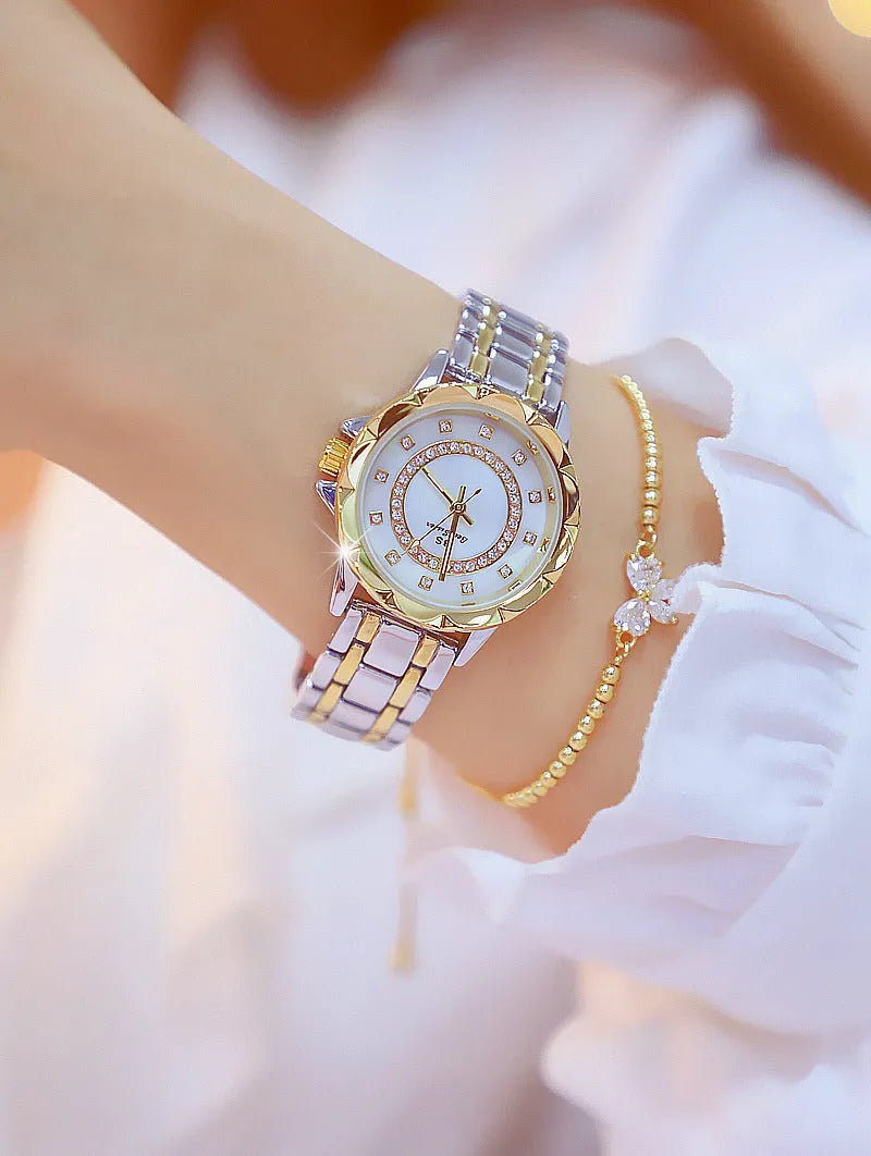 Women's quartz watch with 32mm round dial, alloy case, and mineral glass in a choice of gold or silver finishes