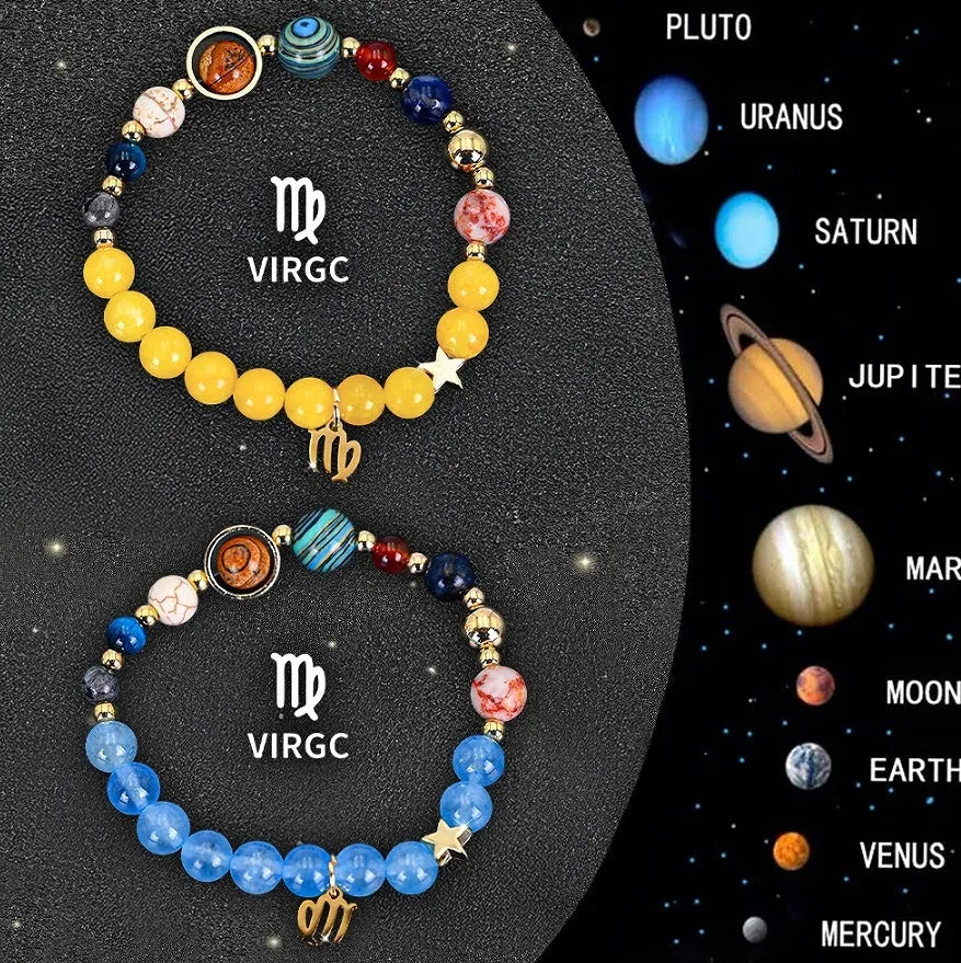 Two natural stone beaded bracelets featuring engraved zodiac signs on a wooden surface.