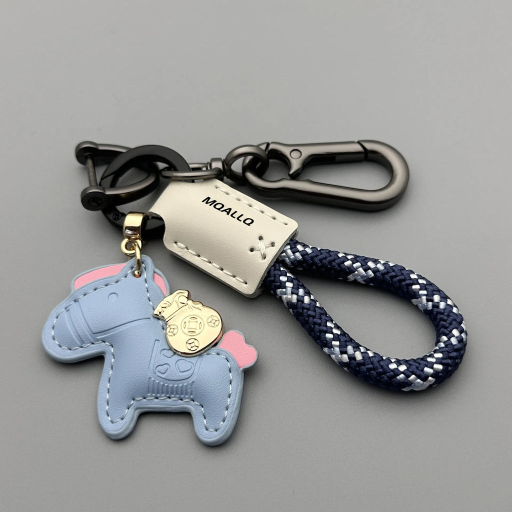 Handmade brown cowhide key ring pendant with zinc alloy pony buckle and green flanelle rope.