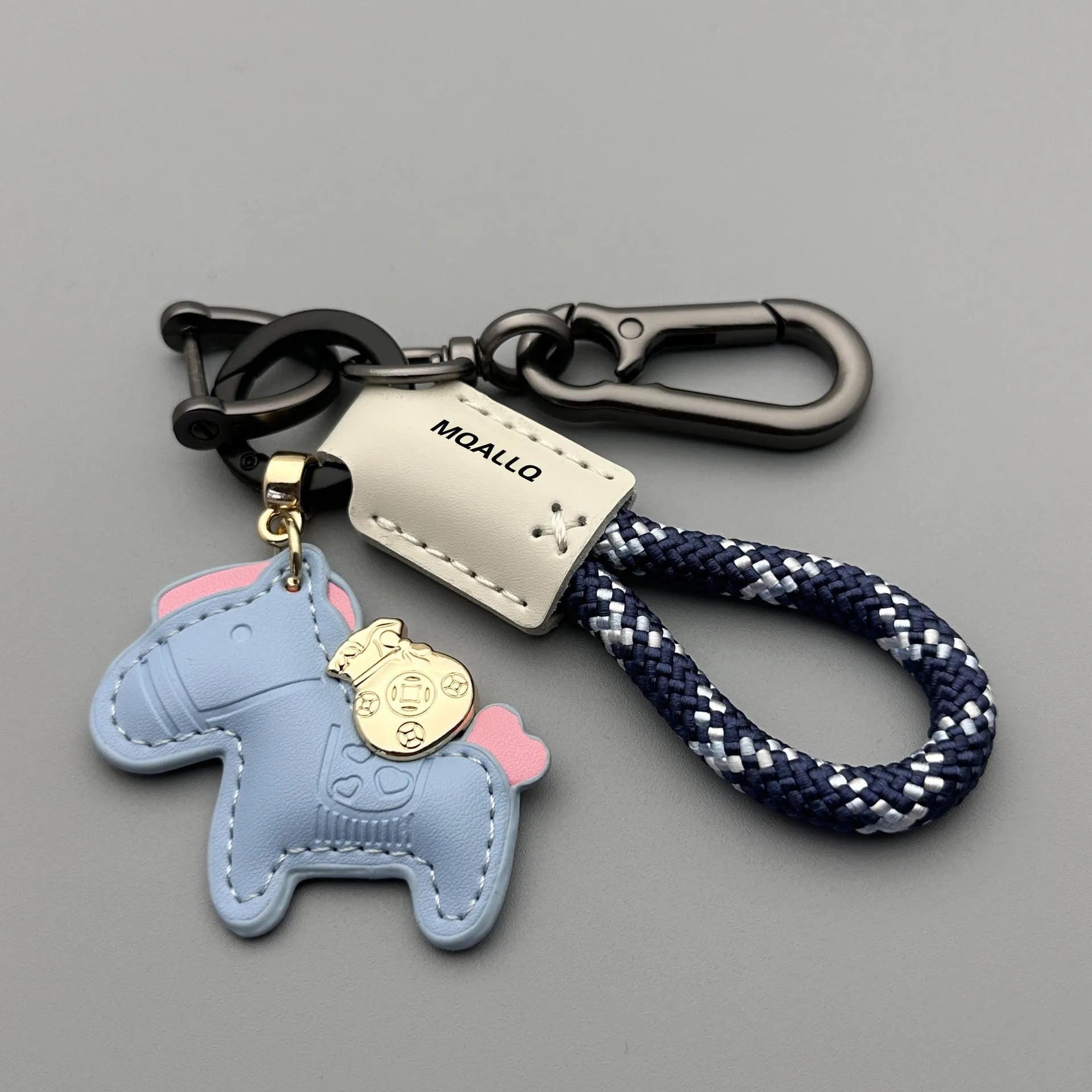 Handmade brown cowhide key ring pendant with zinc alloy pony buckle and green flanelle rope.