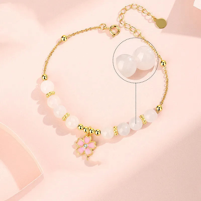 Pink women's bracelet with 925 silver cherry blossom pendant, Hetian jade beads, and gradient epoxy details.