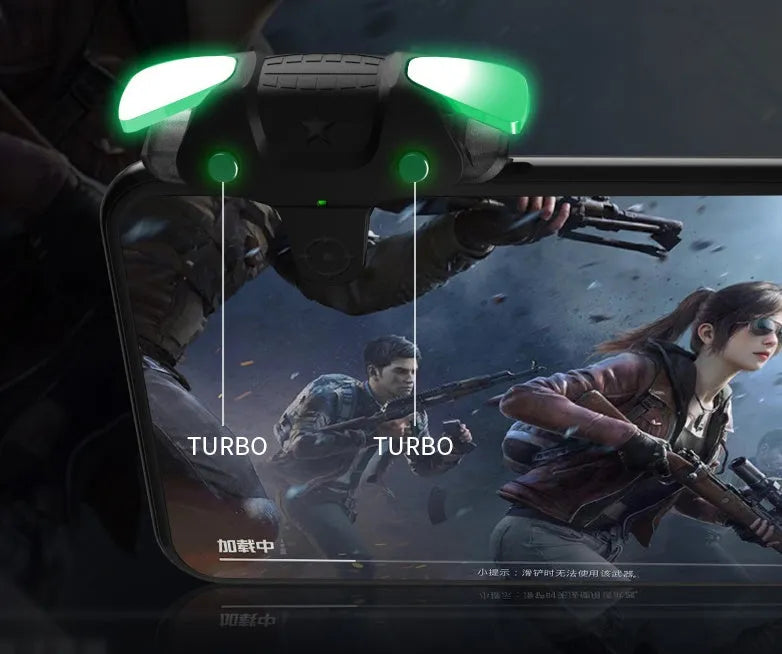 Compact black F5 Bluetooth game controller for mobile phones next to a smartphone.