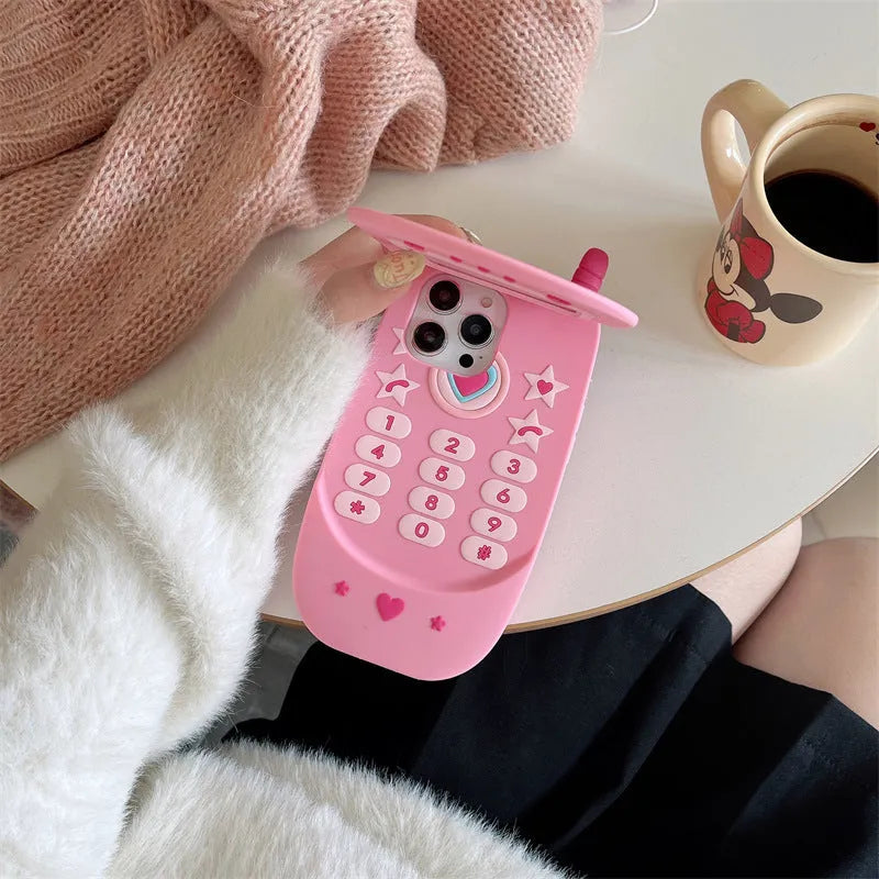 Pink silicone flip phone case with mirror for iPhone models.
