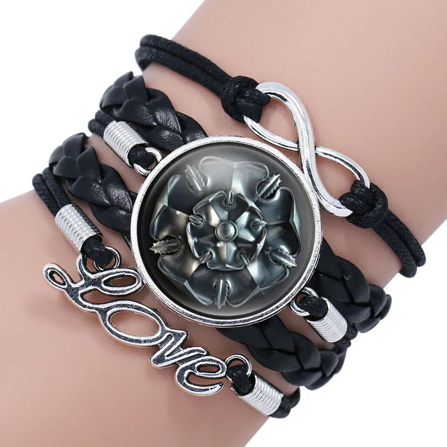 Glass cabochon wrap bracelet with House Stark wolf head and Winter Coming text on metal bangle
