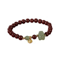 Natural Hetian Jade bracelet with animal modelling in Emperor Sandstone style.