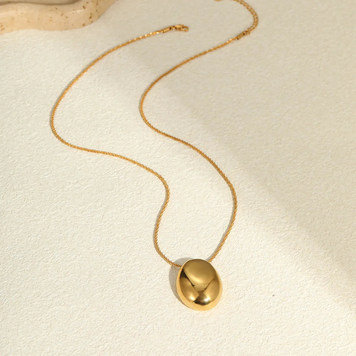 Gold geometric pendant necklace on adjustable 41-50cm chain with stainless steel construction