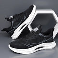 Men's low-top casual shoe in grey mesh with a round toe and light rubber sole.