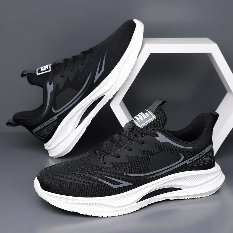 Men's low-top casual shoe in grey mesh with a round toe and light rubber sole.