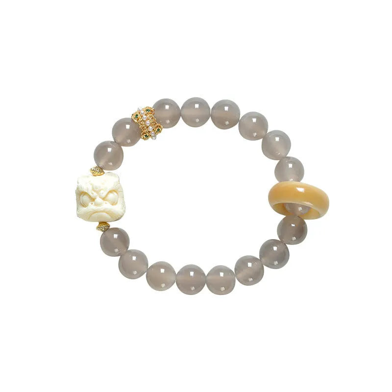 Hand-woven bracelet with 10mm round gray agate and mellite beads, Ivory Xingshi style, unisex design.