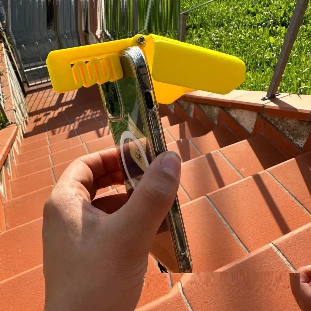 Yellow plastic phone sunshade clip attached to pool float with phone visible