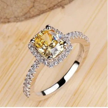 Silver alloy women's ring with artificial gemstone geometric design on white background