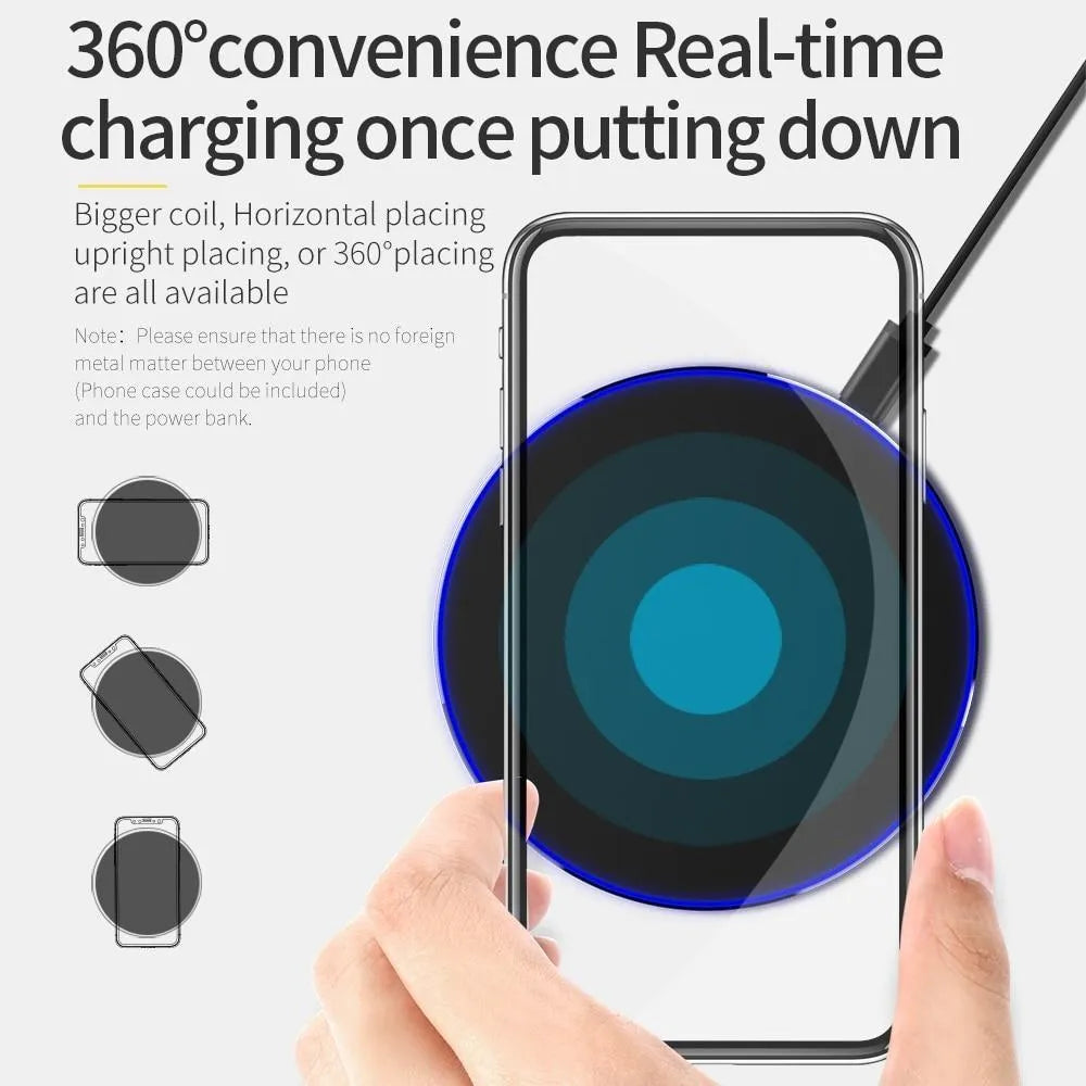 Black ultra-thin square wireless charging pad with USB cable on a desk.