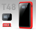 Compact 1200A car jump starter with battery clips, LED light, and USB port on a grey background