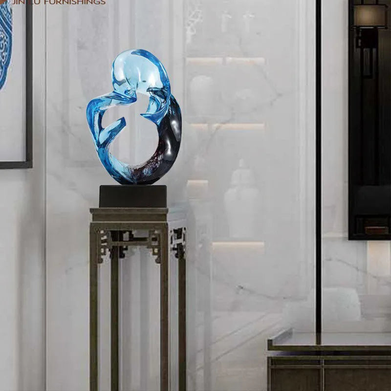 Glass transparent resin craft ornament sculpture in modern simplicity style, shown in orange red and blue colour options.