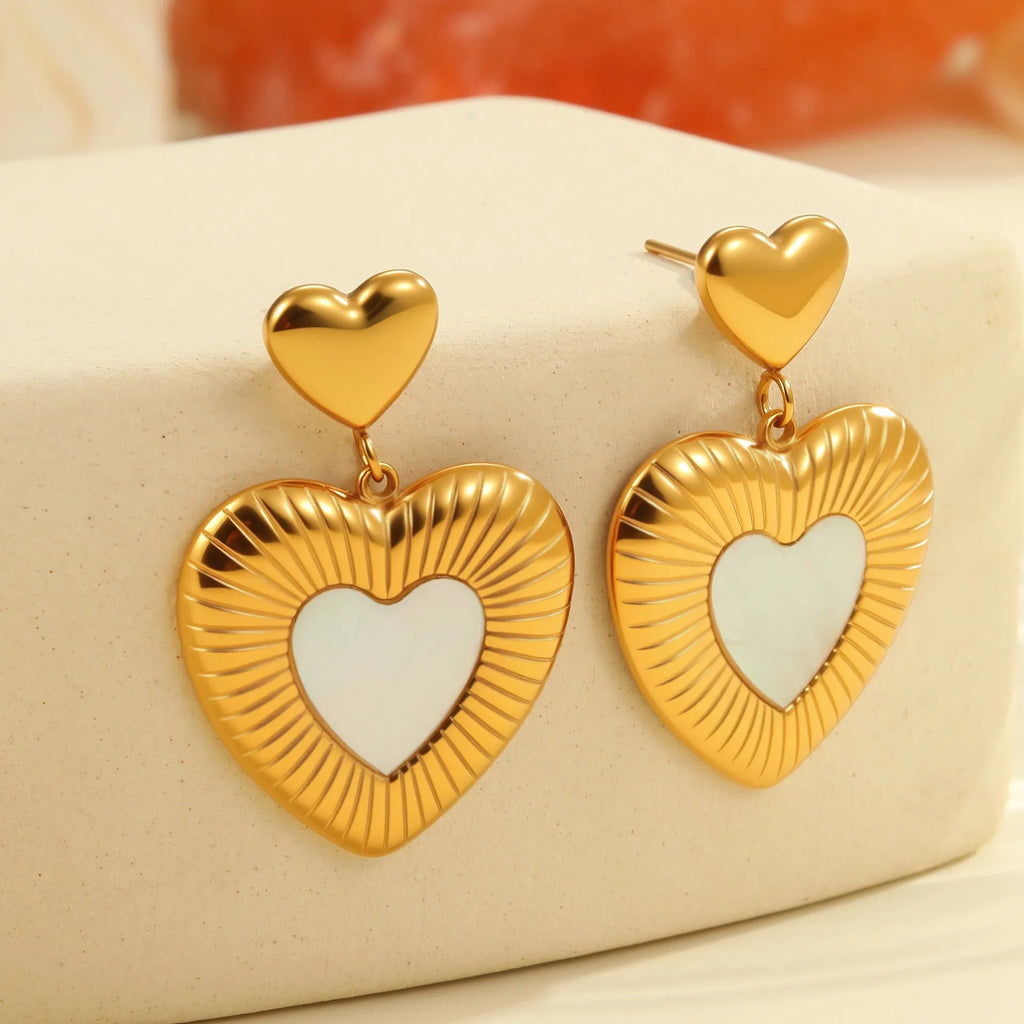 Gold electroplated heart-shaped stainless steel earrings with white fritillary detail
