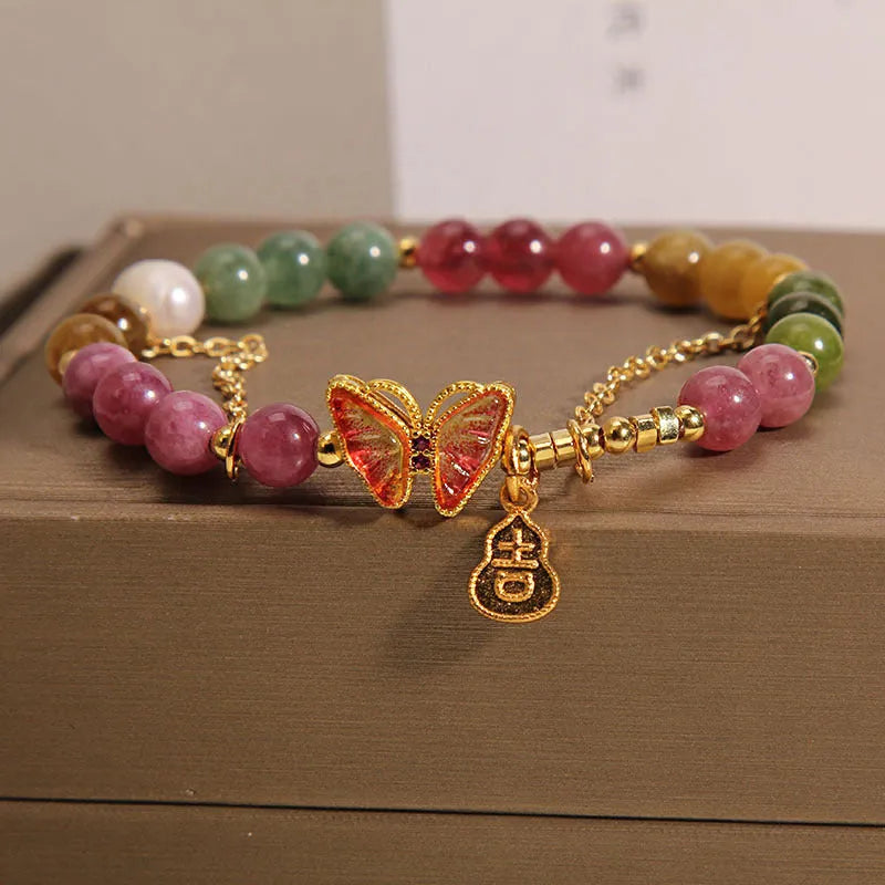 Natural jade coloured agate bracelet with butterfly and gourd pendant.