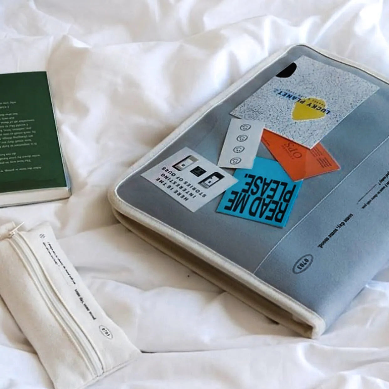 Canvas tablet storage bag with zipper opening and soft handle designed for 12-inch devices, shown in black and white colours