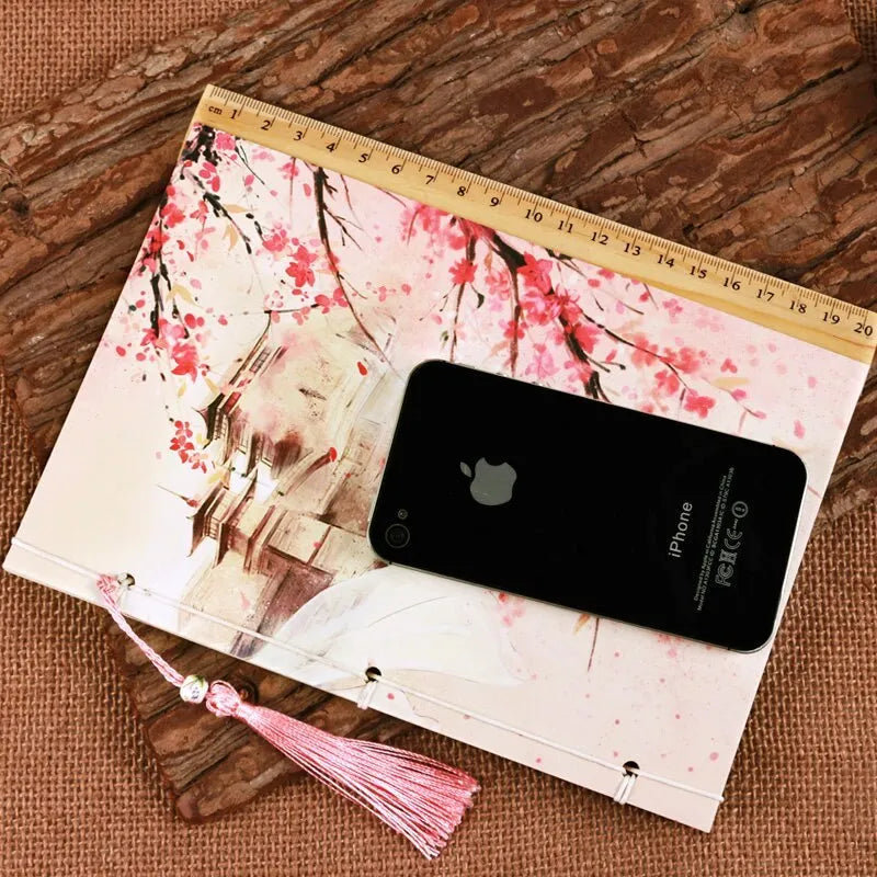 Azalea colour retro Chinese thread-bound notebook with 80g Dolin paper, 140x208mm size, lying open on a flat surface
