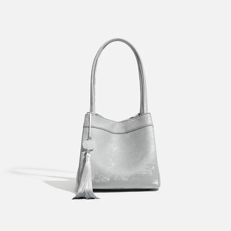 Portable shoulder crossbody bag in black PU leather with open pocket outer and sewing thread detail