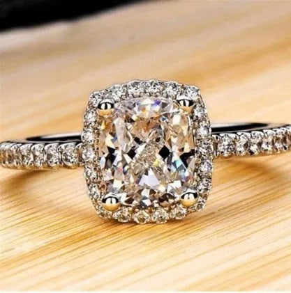 Silver alloy women's ring with artificial gemstone geometric design on white background