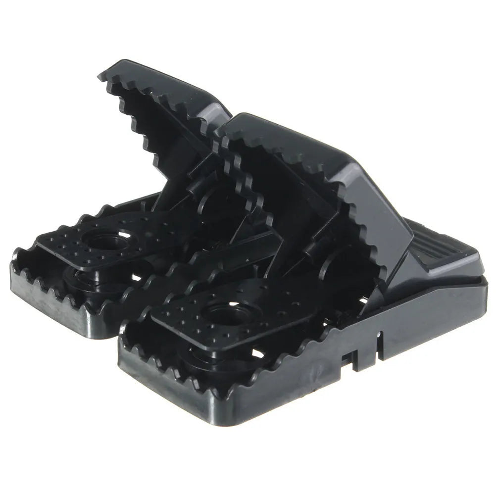 Six black snapping mousetraps showing PC+ABS plastic construction and bite-type mechanism