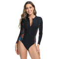 Women's floral print long sleeve one-piece swimsuit on a hanger.