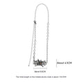 Spider moonstone alloy phone charm with electroplated silver finish and insect pattern pendant on chain.