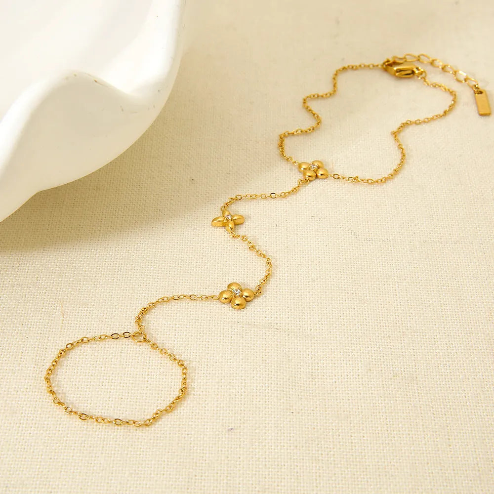 Women's stainless steel bracelet with geometric floral and eight-pointed star design in gold colour