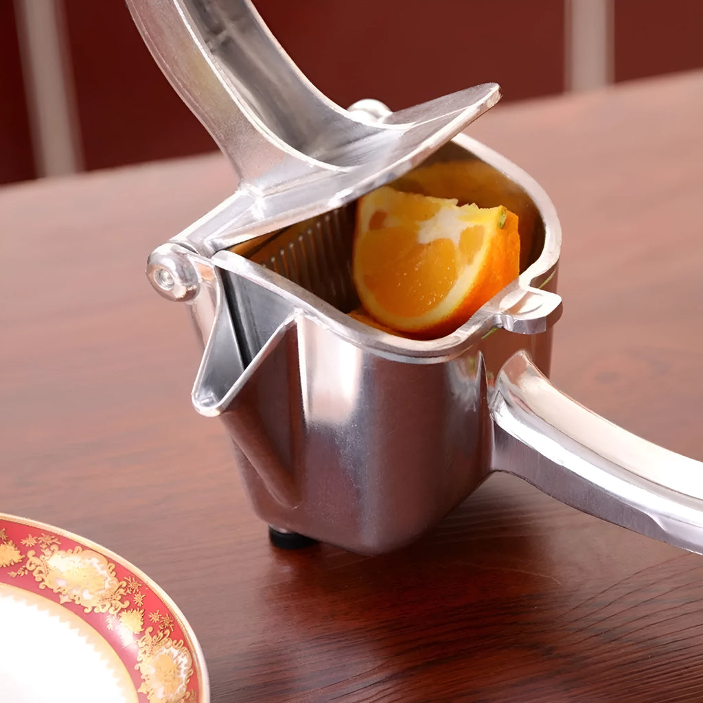 Silver heavy duty aluminium alloy lemon squeezer with large bowl on a counter