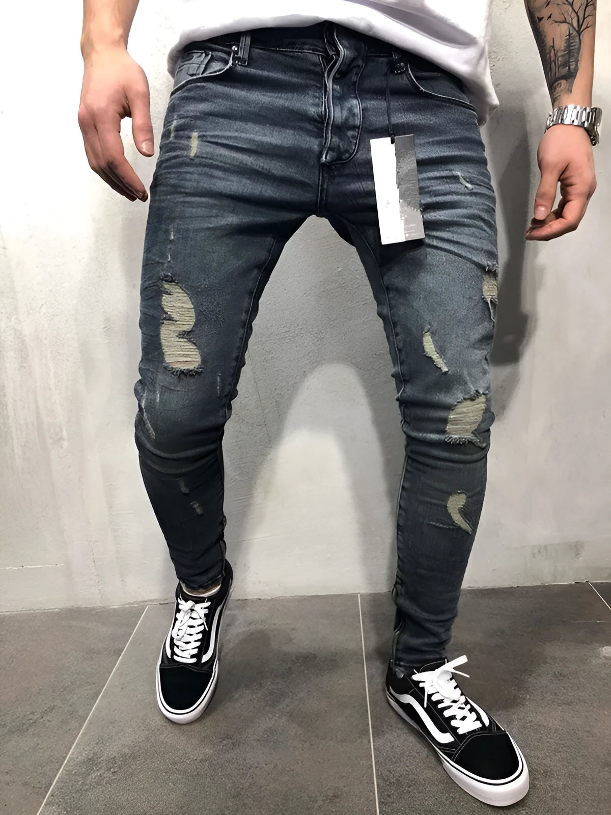 Men's gray blue stretch biker jeans with hole details, slim fit, on a model