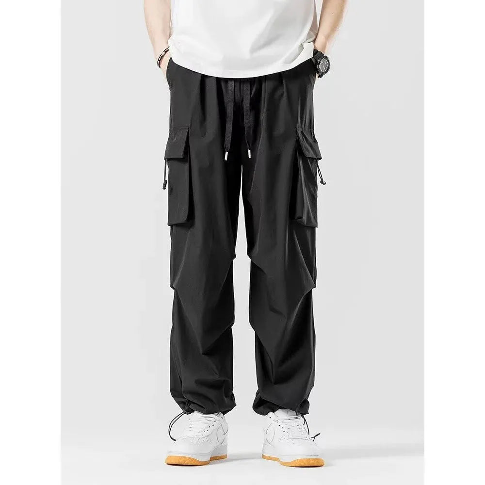 Men's loose straight cargo pants in black with wide-leg cut and drawstring waist