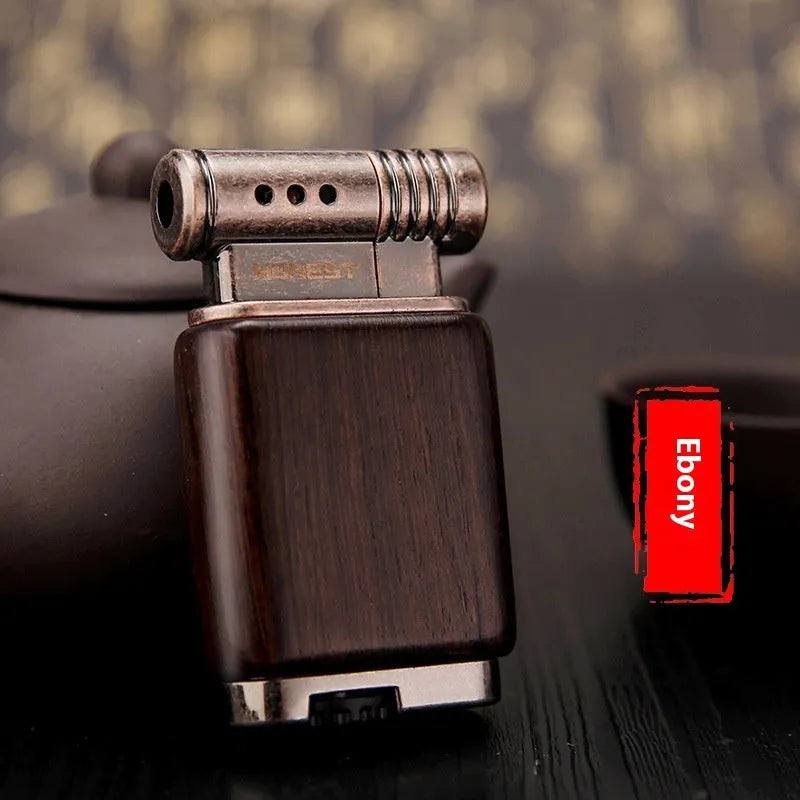 Ebony gas lighter with rosewood sun face design and black wood finish