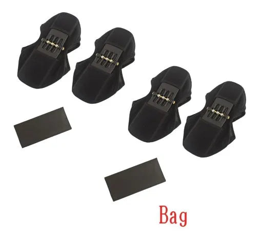 Black spring knee brace support with adjustable straps and visible venting holes, shown on a knee.