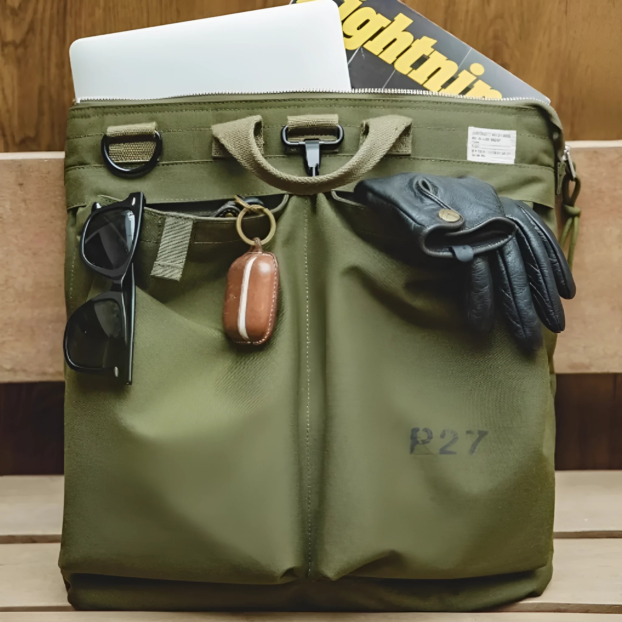 Medium canvas crossbody messenger bag in military green colour with laptop compartment and phone pocket